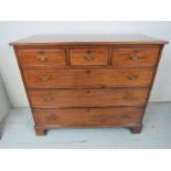 A George III mahogany chest of three short over three long graduated drawers with boxwood stringing