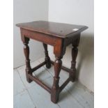 A rustic 18th Century oak joint stool with turned supports est: £150-£250