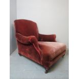 A 19th Century mahogany framed Howard style library chair upholstered in red velvet material and