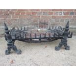 A wrought iron fire basket and dogs est: £80-£120