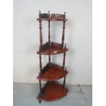 A late 20th Century mahogany corner four tier whatnot in the Victorian style est: £30-£50