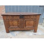 An 18th Century carved oak coffer with iron lock plate and hinges (a/f) est: £80-£120