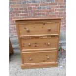 A small 20th Century pine chest of three long drawers with bun handles est: £30-£50