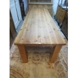 A very large solid pine 20th Century dining table, good solid construction and in clean condition,
