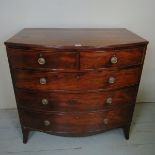 A fine George III mahogany bow fronted chest of two short over three long graduated drawers and