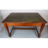 A 19th Century oak writing table / desk with an inset green leather top and with a single drawer to