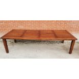 A large 20th Century slatted hardwood dining table, seats 12,