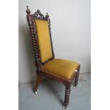 A Victorian carved mahogany hall chair upholstered in gold material and terminating on white china