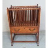 An Edwardian mahogany Canterbury with a spindle top over a frieze drawers est: £30-£50