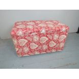 A 20th Century upholstered Ottoman with a lift up lid and finished in a Liberty style material est: