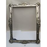 A large white metal frame, embossed with