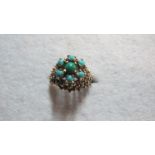 A 9ct gold ring inset with turquoise, si
