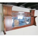 An Edwardian inlaid mahogany over mantle