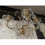 Four brass wall light fittings with cut