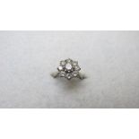 An 18ct gold diamond cluster ring, set w