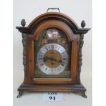 A 20th century German made Georgian-style walnut cased chiming mantel clock with gilt-metal mounts