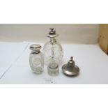 A silver top scent bottle, engraved with a flowers London 1915, a sterling topped atomiser,