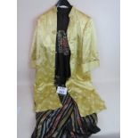 A vintage Chinese yellow silk ladies jacket with delicate all-over decoration,