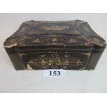 A 19th century Chinese black lacquered travelling box with lavish gilt Chinoiserie decoration and