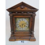 A continental architectural walnut cased striking mantel clock c1900 est: £30-£50