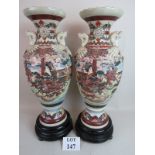 A pair of large and decorative Japanese Satsuma pottery vases, c.