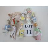 Nine vintage continental china half dolls (one with legs), and a naked piano top female,