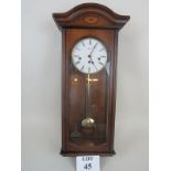 A 20th century German Hermle chiming wall clock, with key and pendulum,