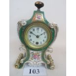 A 19th century French porcelain cased mantel clock in the Rococco taste,