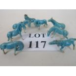 A group of eight early 20th century Chinese pale blue glazed porcelain miniature horses,