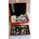 A red jewellery box containing a quantity of mainly vintage jewellery est: £25-£45