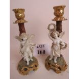 A pair of 19th century porcelain candlesticks, (marked 'W & R'),