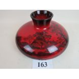 A Royal Doulton flambe vase, the squat bulbous circular form decorated with a silhouetted landscape,