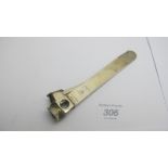 A silver cigar cutter with engine turned decoration, marked MW 925,