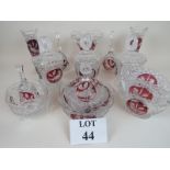 Fourteen pieces of Bohemian ruby-flashed glassware, including covered bon bon dishes, table bells,
