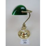 Traditional style brass bankers lamp with green glass shade,