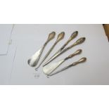 A pair of silver handled glove stretchers embossed with bird and bird nest and two pairs of silver