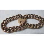 A 9ct gold link bracelet with padlock cl