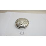 A silver embossed circular box, Birmingh