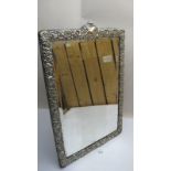 A large silver framed dressing table mir