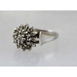 AN 18CT WHITE GOLD DIAMOND CLUSTER RING, size K