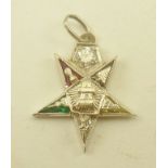 A DIAMOND SET PENDANT of star form, with various symbols considered to be of Masonic interest,