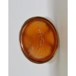 A 19TH CENTURY YELLOW METAL FOB SEAL, contains an oval intaglio of Britannia, 1.5cm x 1.7cm