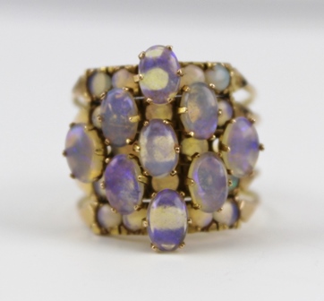 A LADY'S DRESS RING, comprising five hinged sections of yellow metal, set with opals, size O - Image 2 of 3