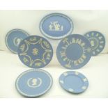 A COLLECTION OF SEVEN ASSORTED WEDGWOOD CERAMIC BLUE GROUND PLATES with cameo decoration, includes a