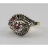 A LARGE BRILLIANT CUT DIAMOND RING, set with shoulders of spiralling baguette cut diamonds, on an