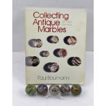 FIVE LARGE HAND-MADE MARBLES, includes red latticino, together with a BOOK "Collecting Antique