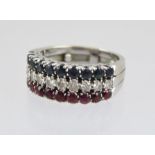 A LADY'S DRESS RING, mounted with three bands of cut stones, ten stones in each line, diamonds,