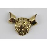 A 9CT GOLD CAST LION MASK with pendant jewellery mounts to either side, 7g