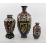 A 20TH CENTURY CLOISONNE VASE of hexagonal form, decorated with alternate shields of dragons and