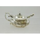 A GEORGIAN DESIGN LIDDED SILVER MUSTARD POT, having repousse swag decoration, marks worn but